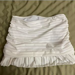 White ruffled mini skirt